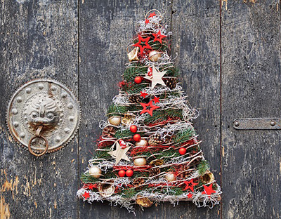 House door with Christmas tree wreath