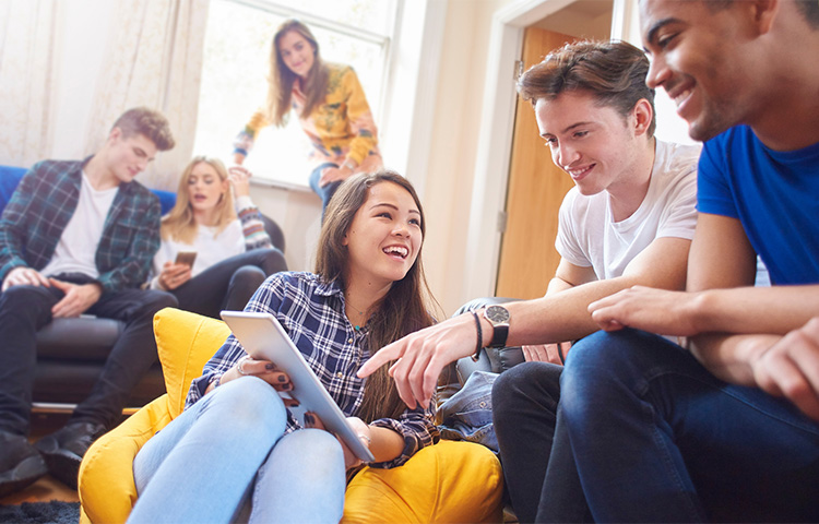 Groups of students in a living room