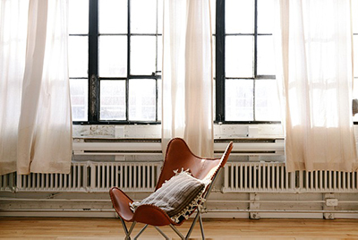 Clean empty house - chair under a window