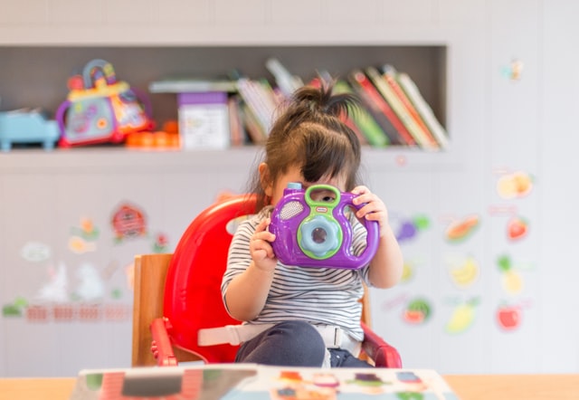 Toddler in a highchair - Credit Tanaphong Toochinda on Unsplash