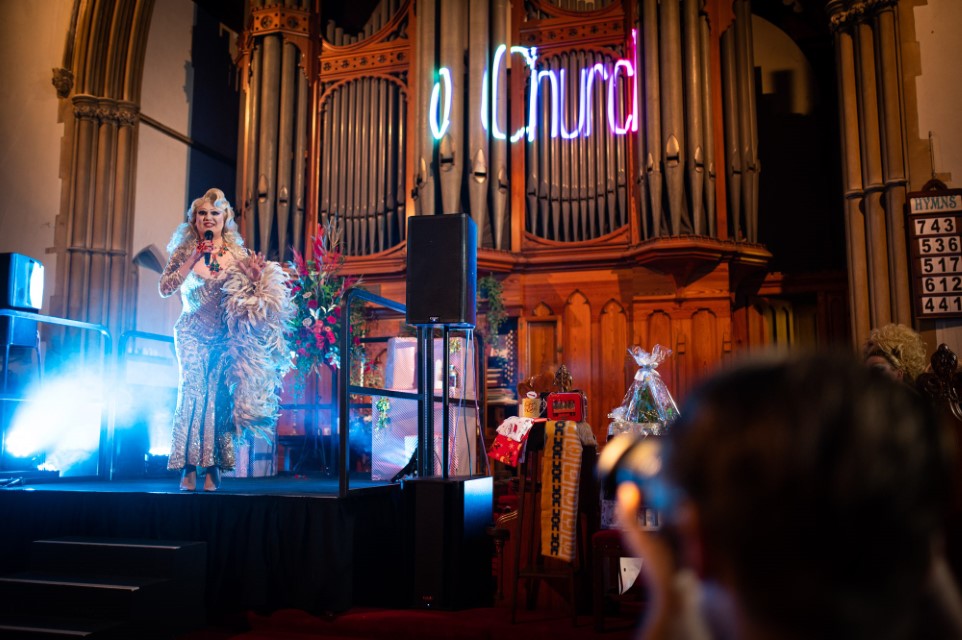 Drag queen on stage at St Andrew's Church