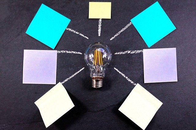 Light bulb and post-it notes for utility bills