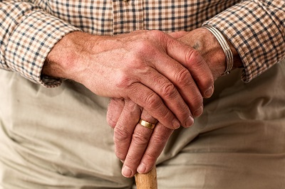 Pensioner with walking stick