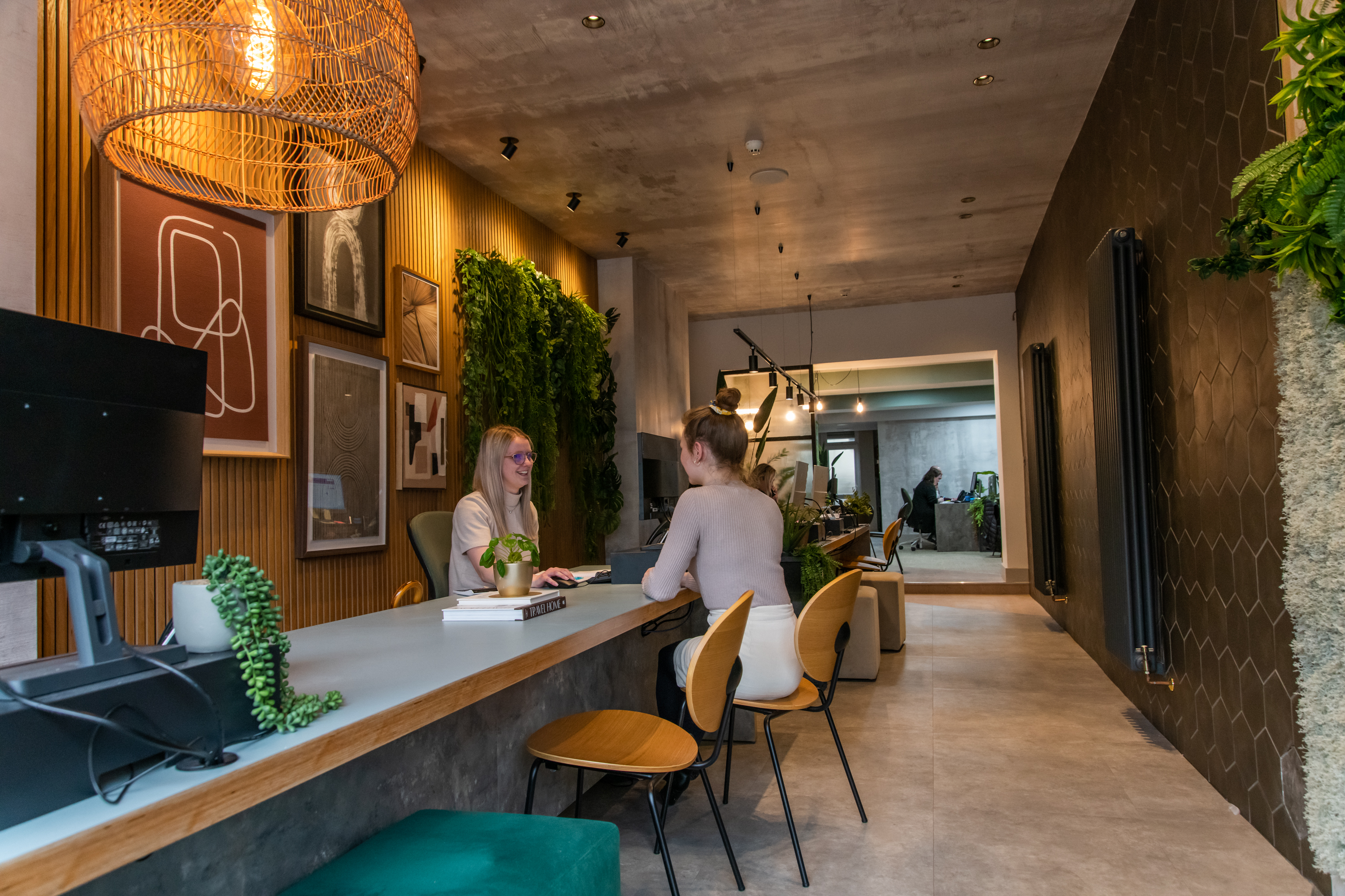 Interior of Roath branch with staff meeting a client